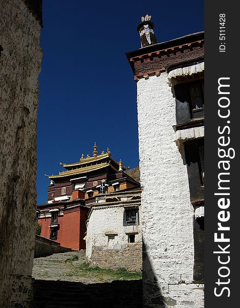 A lama Buddhist Temple in Rikeze,Tibet China.Ancient houses with white wall and splendid golden ornament of local traditional style. A lama Buddhist Temple in Rikeze,Tibet China.Ancient houses with white wall and splendid golden ornament of local traditional style.