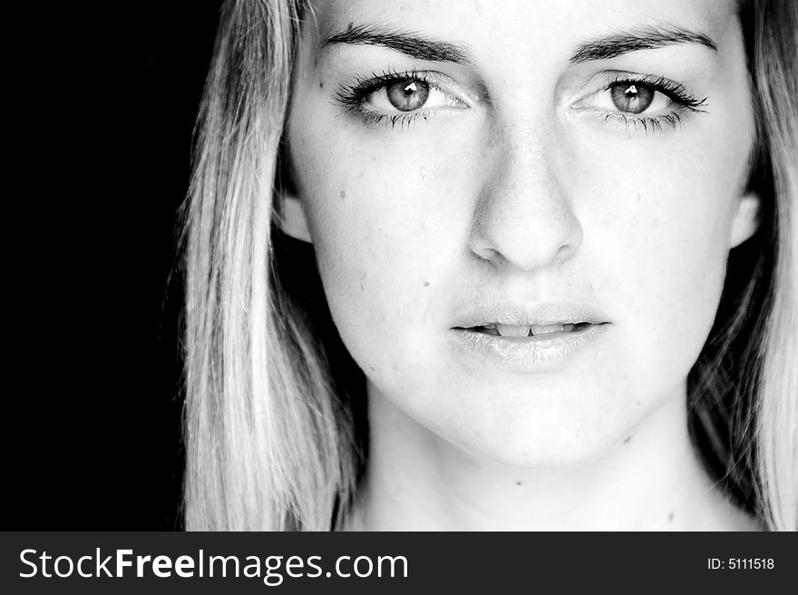 Young woman close portrait in black and white.