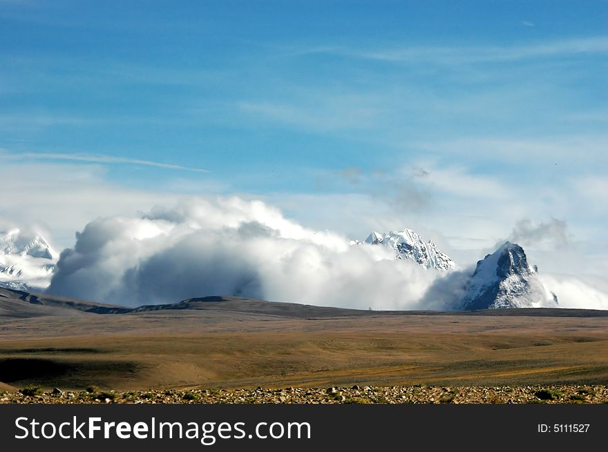 The Snow Mountain In Clouds