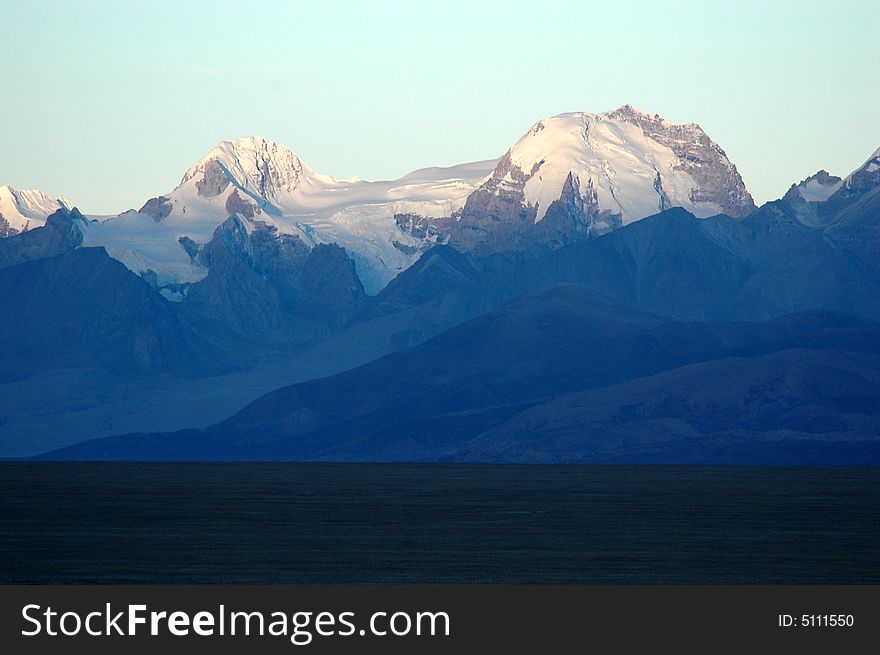 The Tibetan snow mountain in the morning sunshine,Rikeze,Tibet,China. The Tibetan snow mountain in the morning sunshine,Rikeze,Tibet,China.