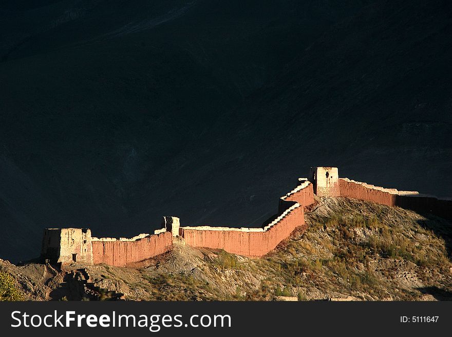 The ancient castle wall in the sunset sunshine,Jiangzi,Rikeze,Tibet,China. The ancient castle wall in the sunset sunshine,Jiangzi,Rikeze,Tibet,China.