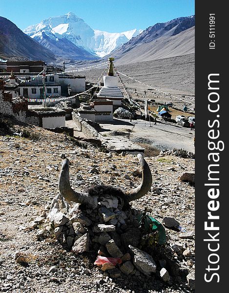The Tibetan Lama temple at the foot of the Everest Peak.The Yak head sacrifice on a stone pile in the tibetan buddhist worship ceremony. The Tibetan Lama temple at the foot of the Everest Peak.The Yak head sacrifice on a stone pile in the tibetan buddhist worship ceremony.