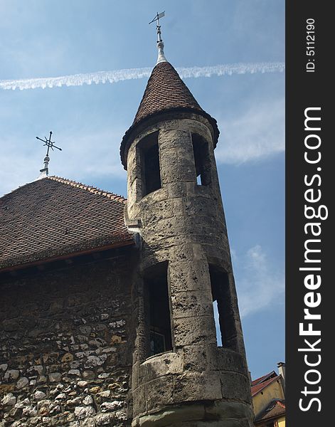 Tower of a medieval stone castle, in blue sky, vertical. Tower of a medieval stone castle, in blue sky, vertical.