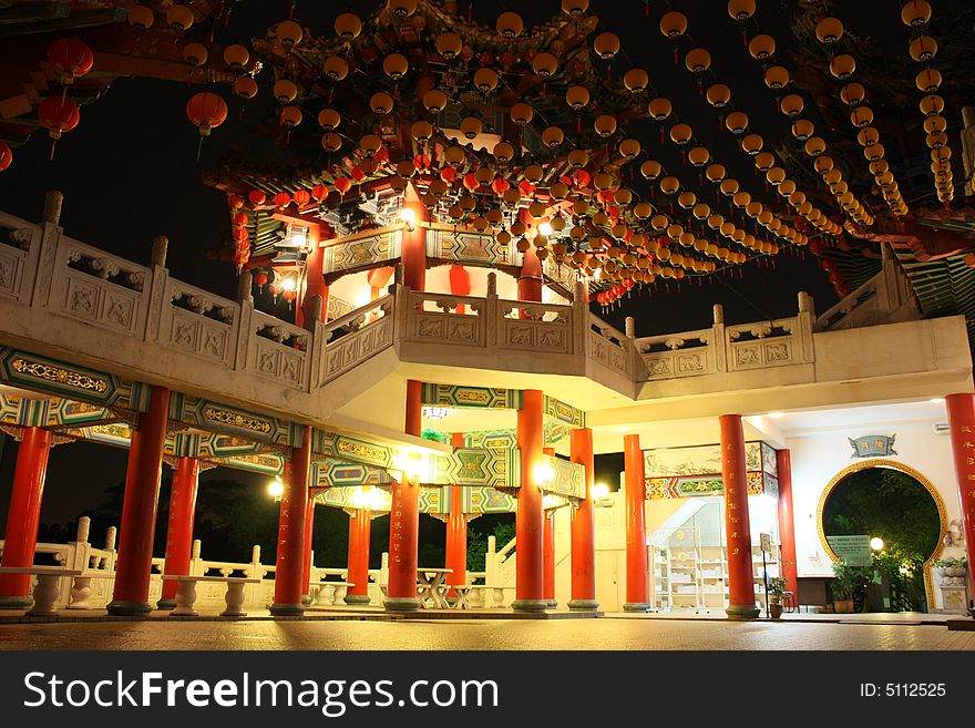 A chinese style pavilion decorated with yellow laterns. A chinese style pavilion decorated with yellow laterns