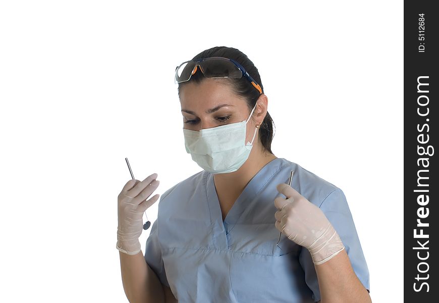 Female doctor with dental tools at work. Female doctor with dental tools at work