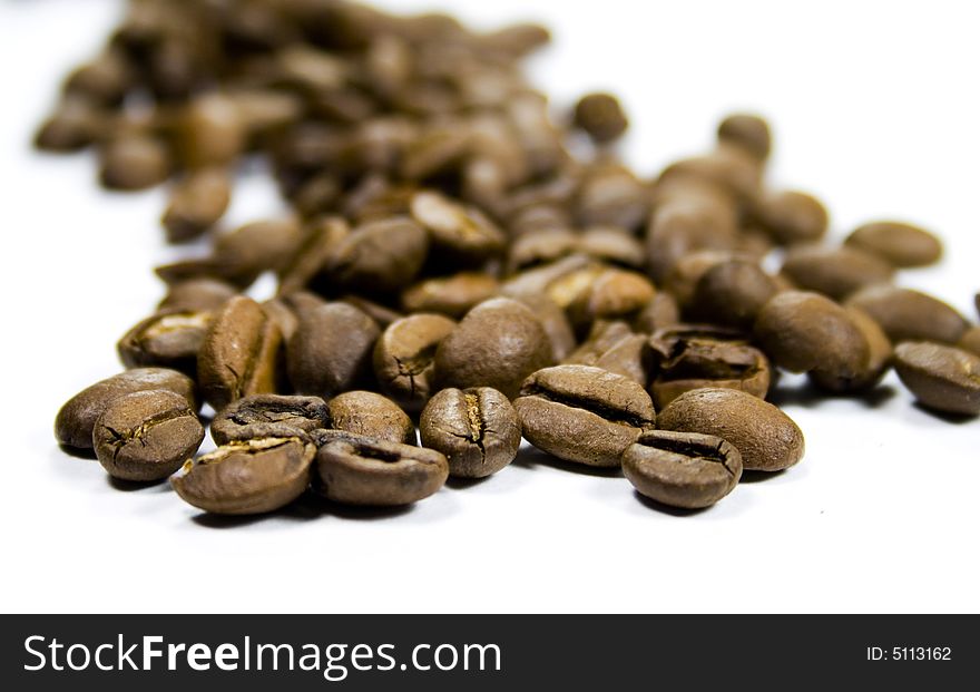 Coffee beans close-up on white