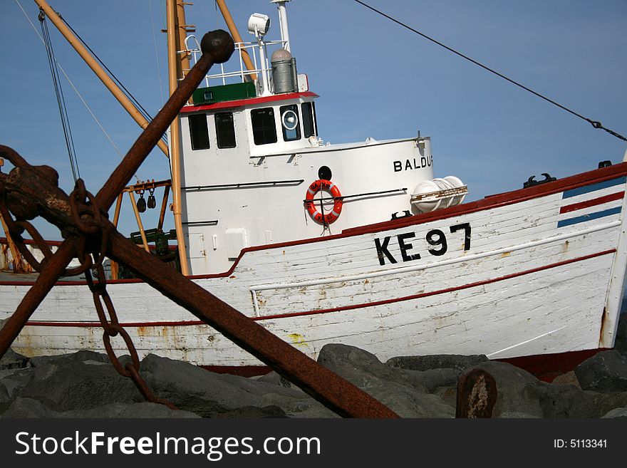 Old boat/ship on shore and the anchor. Old boat/ship on shore and the anchor