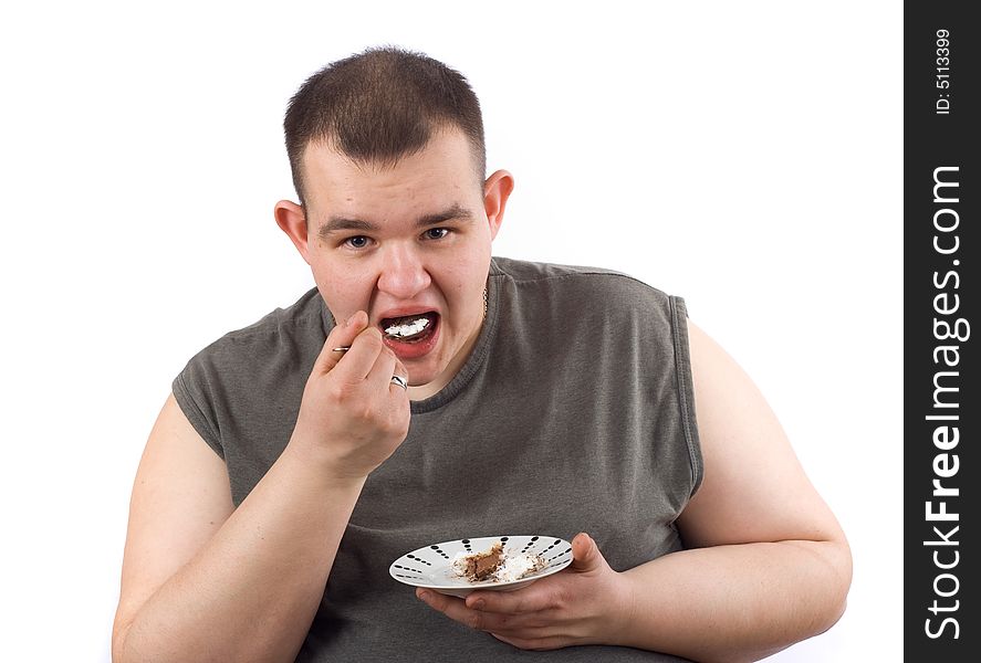 Man eats cake - photo on the white background