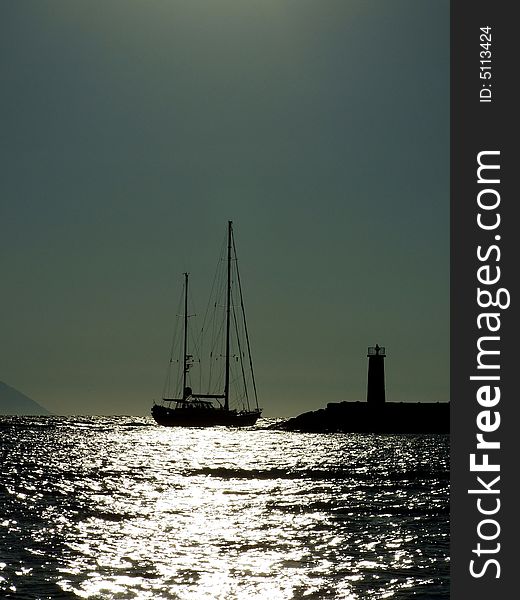 Marine sunset, yacht in the rays of the sun. Marine sunset, yacht in the rays of the sun
