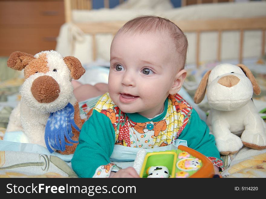 Beautiful baby with toys close up. Beautiful baby with toys close up