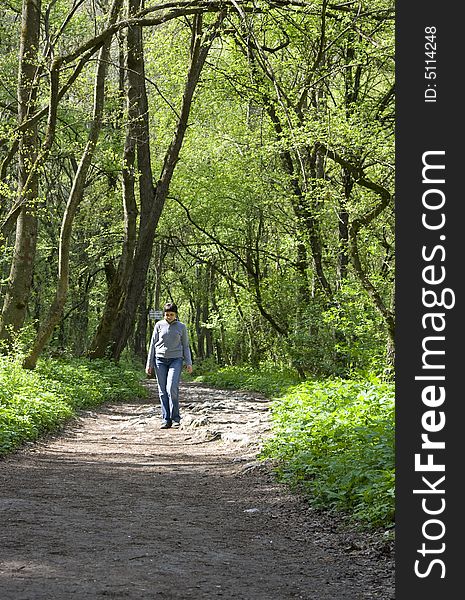 Woman having a walk in the forest