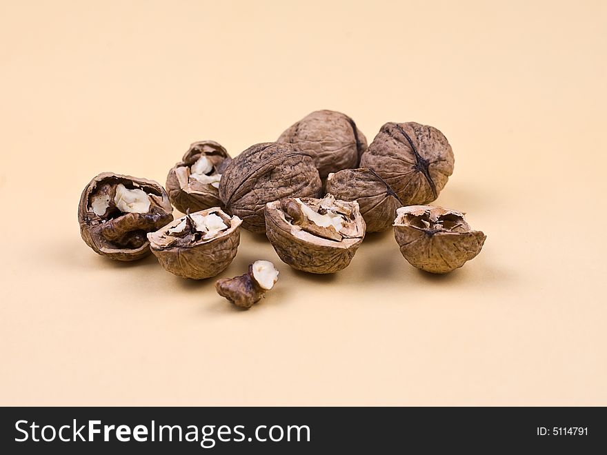 Walnuts on the orange background