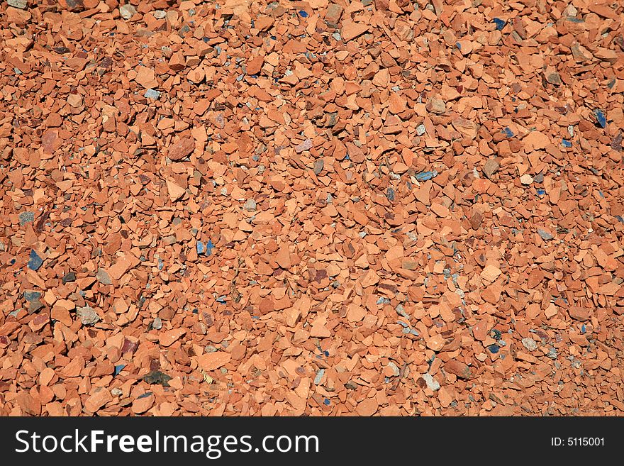 Red brick chips in a large pile