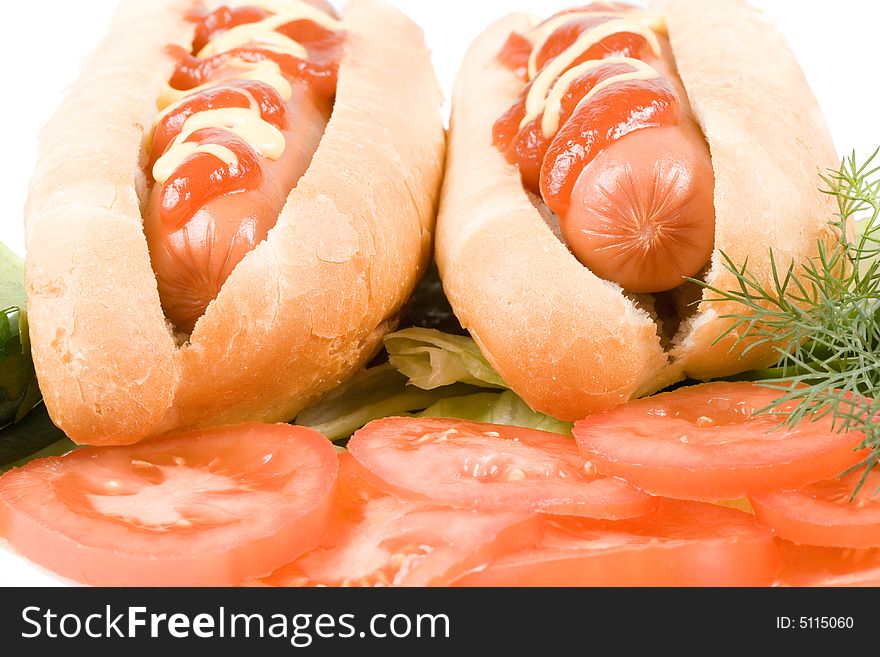 Hot dogs with vegetables isolated on a white background