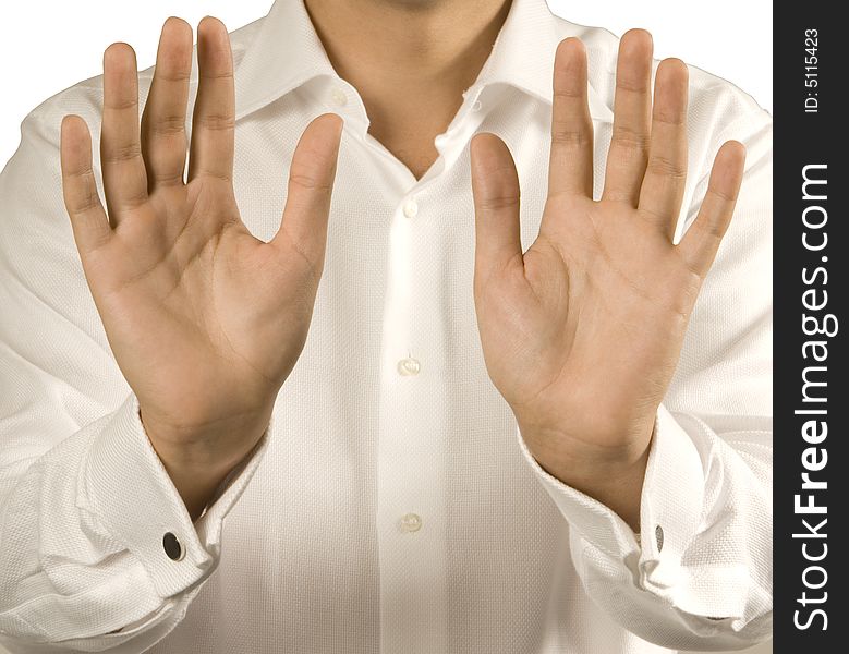 Men's hands palms forward against the backdrop of white shirts. Men's hands palms forward against the backdrop of white shirts