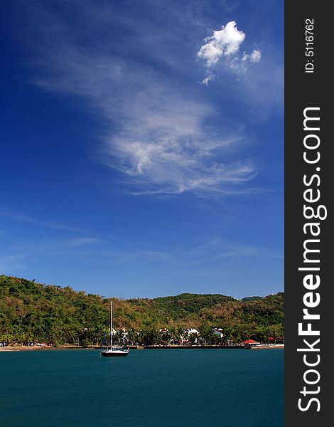 Sail boat on a calm sunny afternoon. Sail boat on a calm sunny afternoon