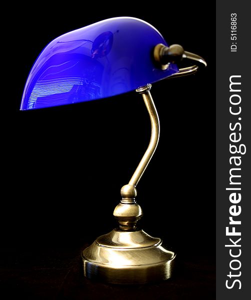 Blue old-fashion lamp on black crisp background