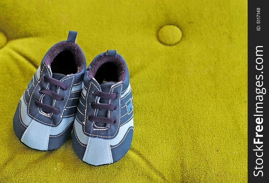 Pair of baby sneakers with laces in two shades of blue. Pair of baby sneakers with laces in two shades of blue