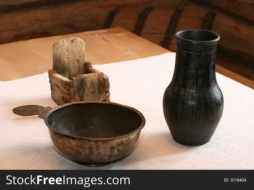 Ancient utensils on a table in the rural house