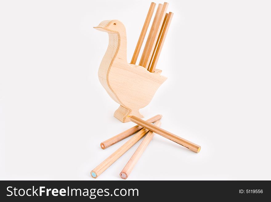 Wooden chicken with to pencils draw with