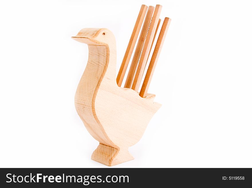 Wooden chicken with pencils on a white background