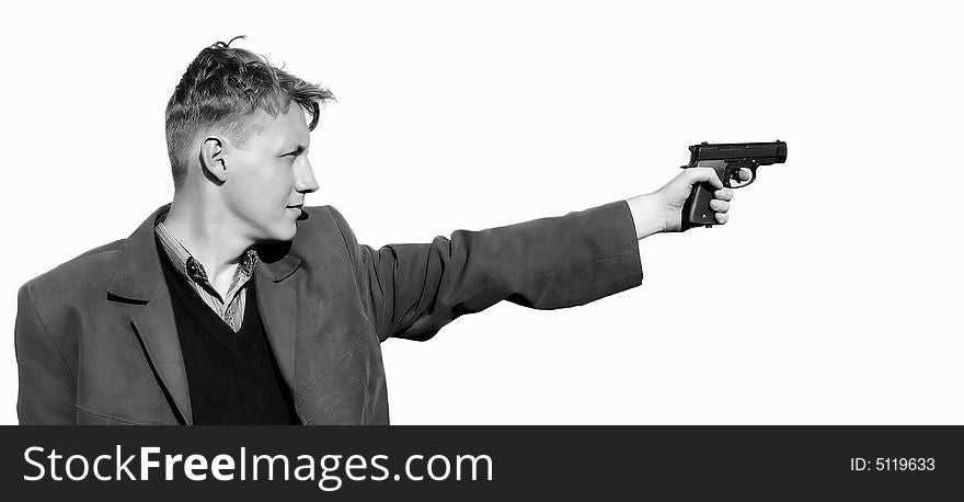 A young man standing with a gun