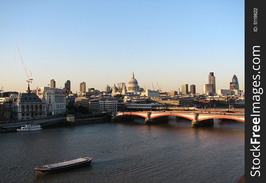 Sunset at the Thames. A view to St.Paul' s cathedral and office buildings.