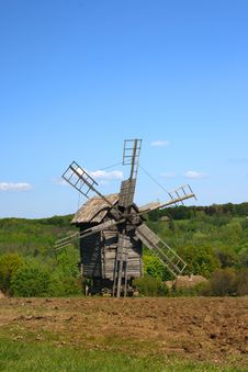 Windmill With Fresh Green Grass And Clear Blue Sky Stock Photos Windmill With Fresh Green Grass And Clear Blue Sky Stock Photos
