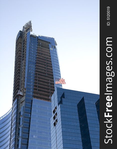 A new blue tower under construction with an American flag on top. A new blue tower under construction with an American flag on top