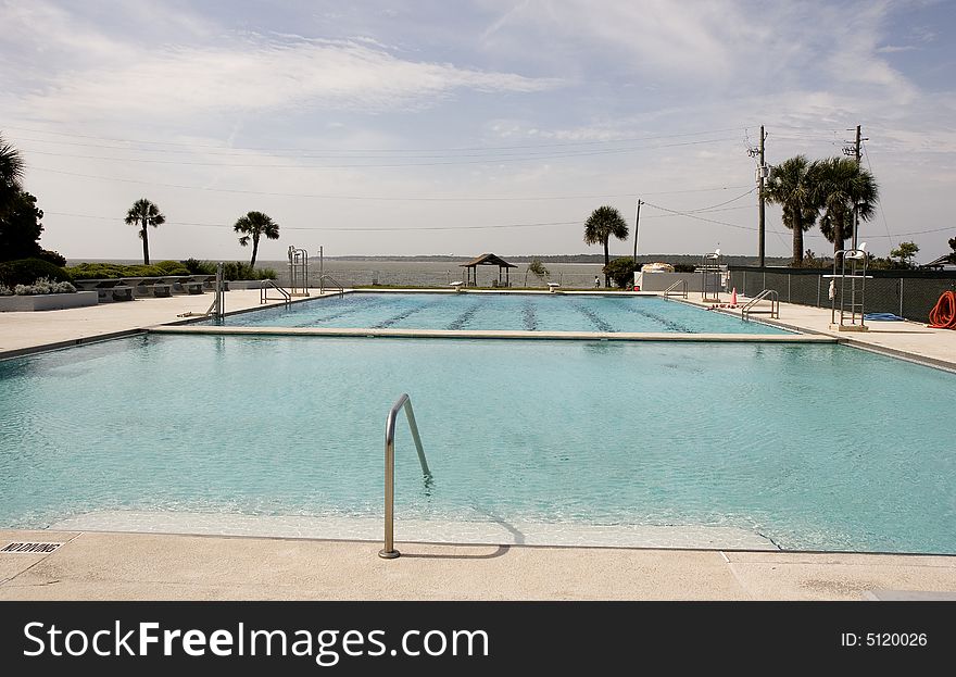 An empty swimming pool on the beach in early spring. An empty swimming pool on the beach in early spring