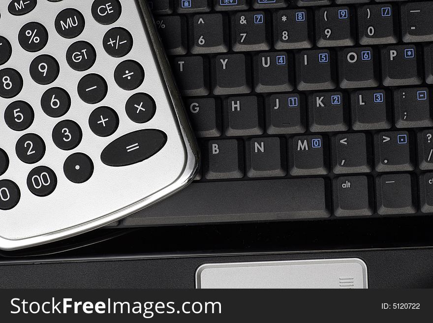 Business Tools - Silver Calculator On A Black Laptop Keyboard. Business Tools - Silver Calculator On A Black Laptop Keyboard