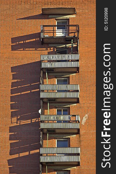 Balconies on a wall of the brick house. Balconies on a wall of the brick house.