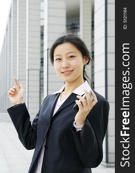 Asian business women holding a mobile phone