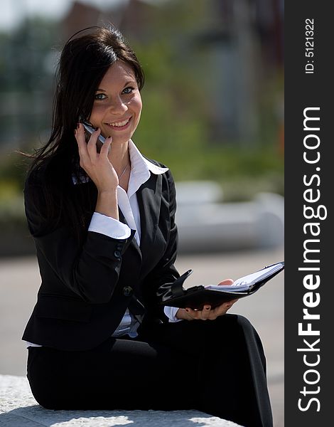 Young businesswoman making a phone call. Young businesswoman making a phone call