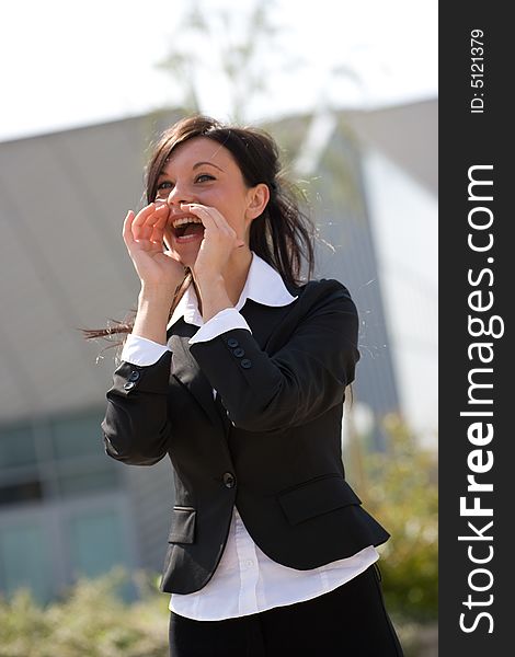 Young businesswoman shouting outdoors in  a sunny day. Young businesswoman shouting outdoors in  a sunny day