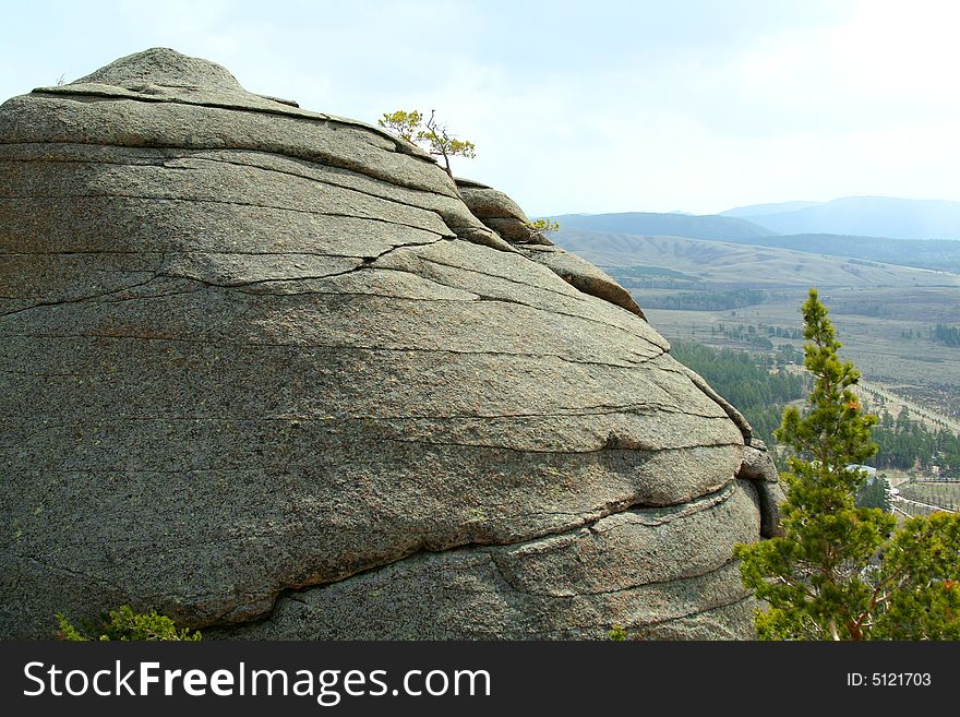 Close up of rock on background of beautiful landscape