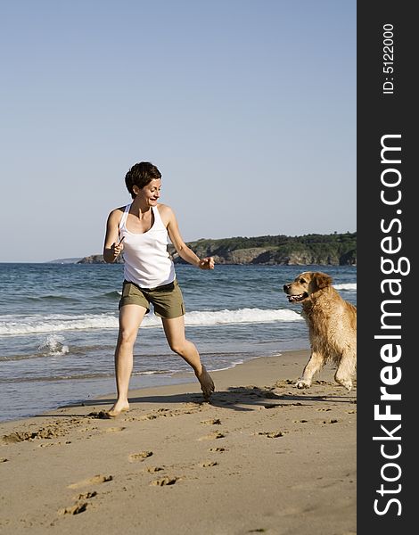 Young Girl And Dog Playing