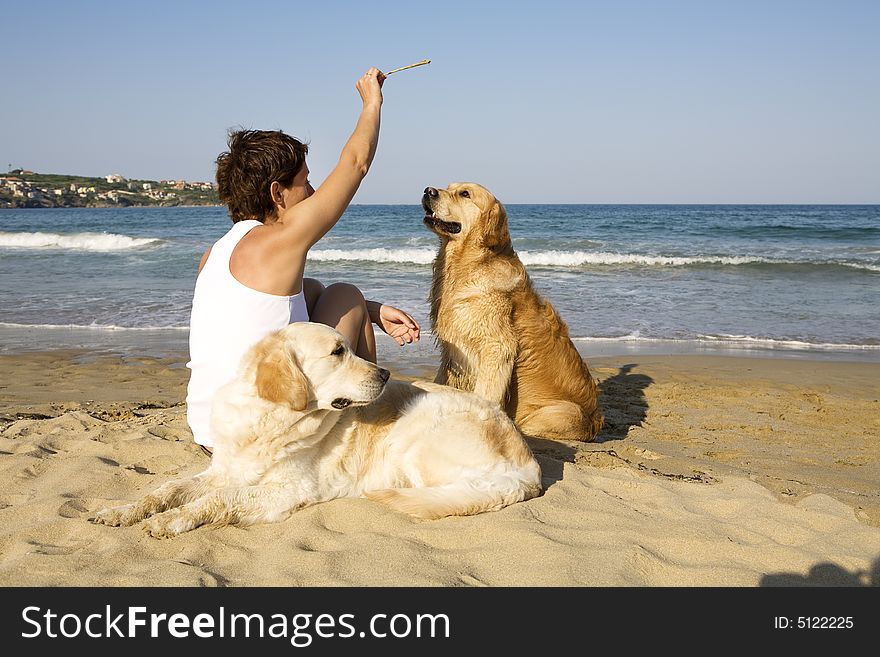 Young Girl And Sitting With Her Dogs