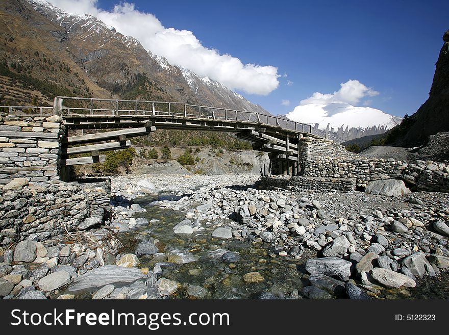 Wooden footbridge on the annapurna circuit, nepal