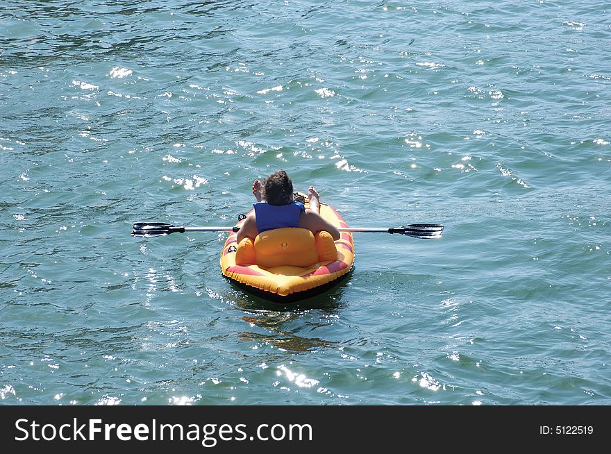 Man relaxing in an inflatable kayak