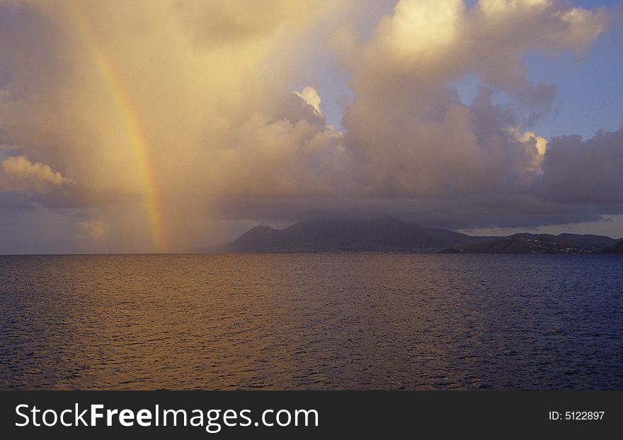 Early morning at St kitts with a rainbow over the island