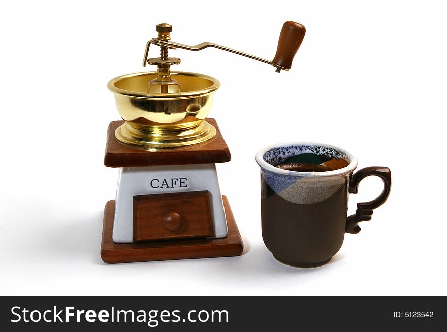 Coffee grinder and mug isolated on white background