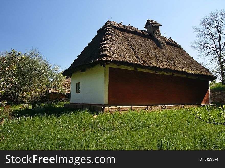 Old traditional ukrainian house with thatched roof