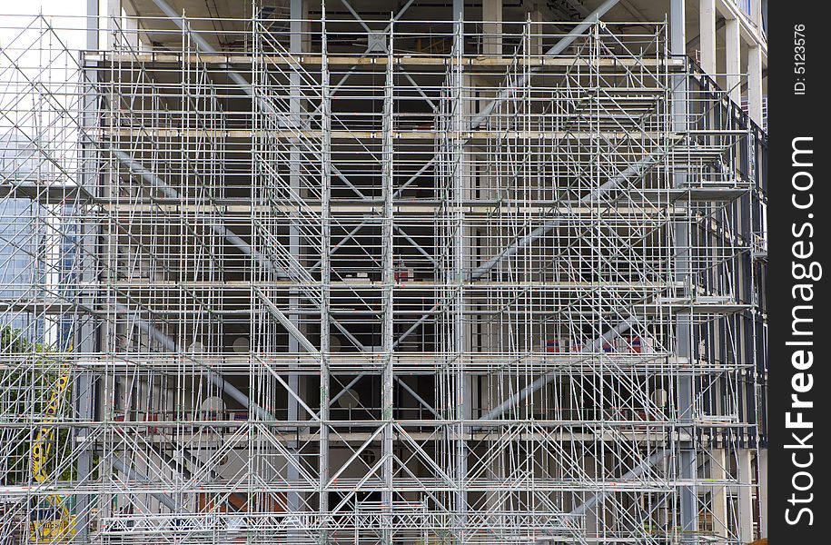 Complex scaffolding for skyscraper under construction. Complex scaffolding for skyscraper under construction