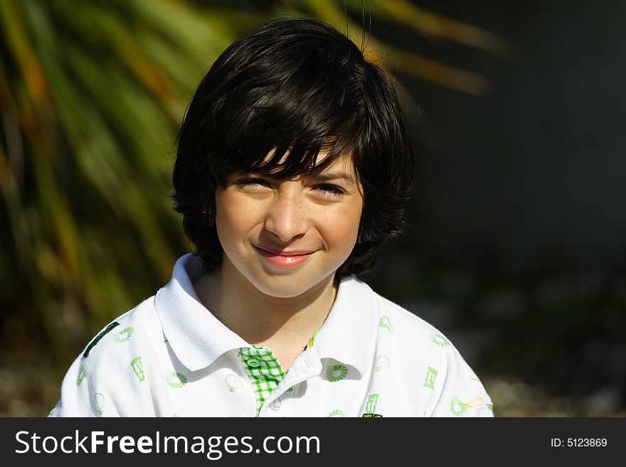 Young caucasian boy smiling at the photographer. Young caucasian boy smiling at the photographer.