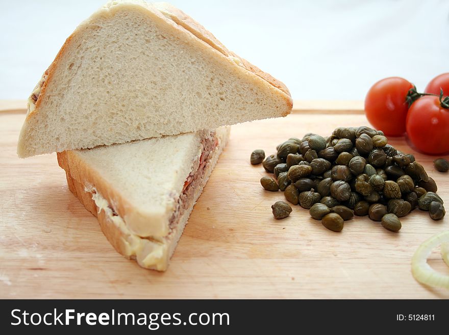 2 fresh sandwiches with fish and some capers