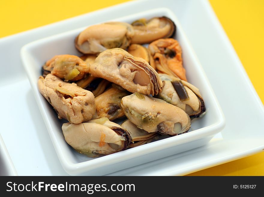 Some fresh mussels in decorate table ware