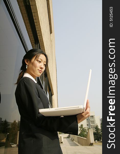 Woman studying on PC in park. Woman studying on PC in park