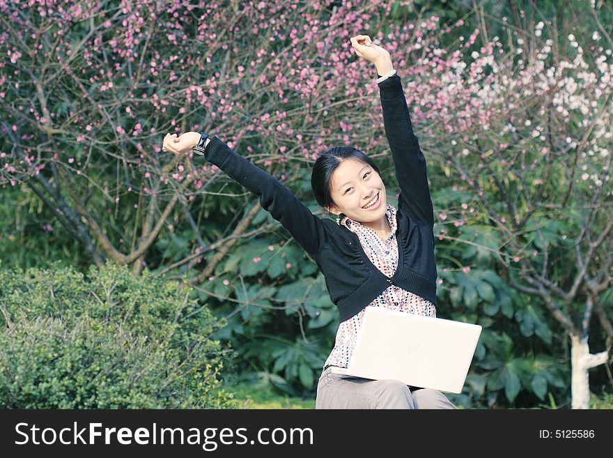 Woman studying on PC in park. Woman studying on PC in park