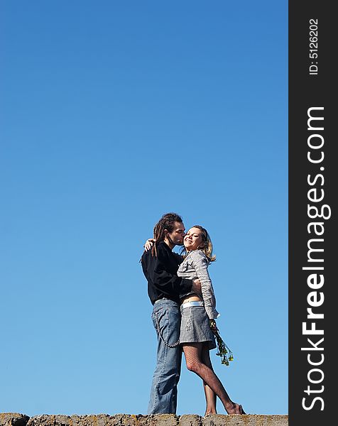 Couple strong kissing under the sky. Couple strong kissing under the sky